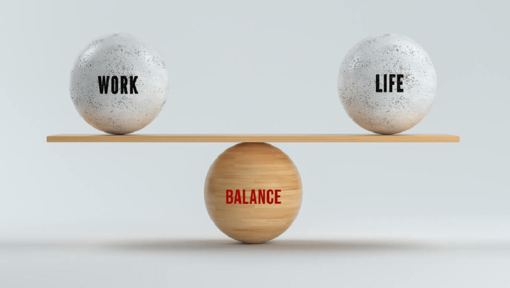 Work-Life Balance scale with 'WORK' and 'LIFE' on a balanced beam.